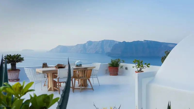 Whitewashed terrace overlooking the Santorini caldera and Aegean Sea